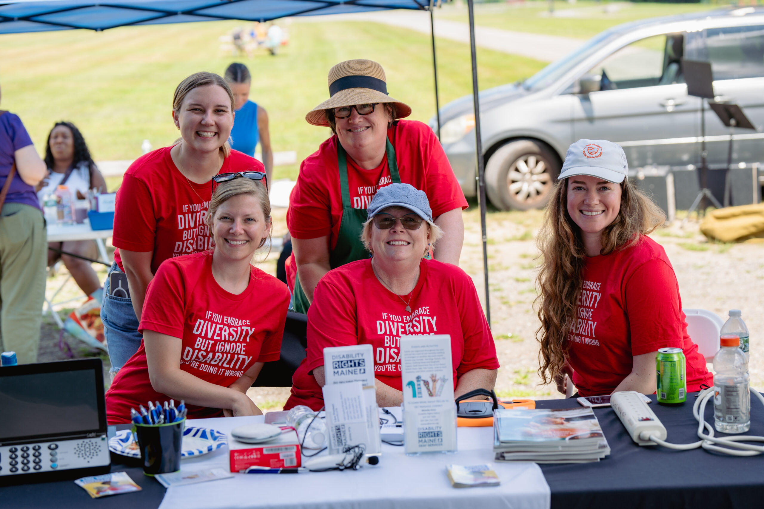 A group of 5 DRM staff smile at the camera.