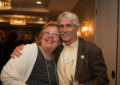 Two people hug at the DRM celebration.