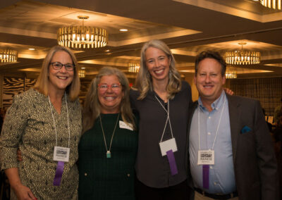 Group of four people at DRM celebration.
