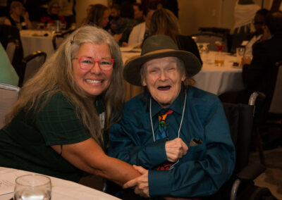 Two people smile at DRM celebration.