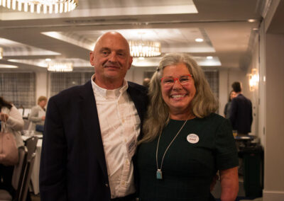 Kim Moody and Noel Sullivan smile.